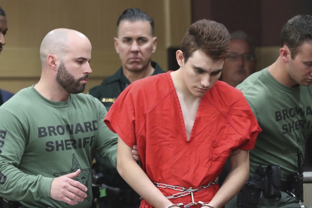 Nikolas Cruz is lead into the courtroom before being arraigned at the Broward County Courthouse in Fort Lauderdale, Florida., on Wednesday, March 14. Photo: AP