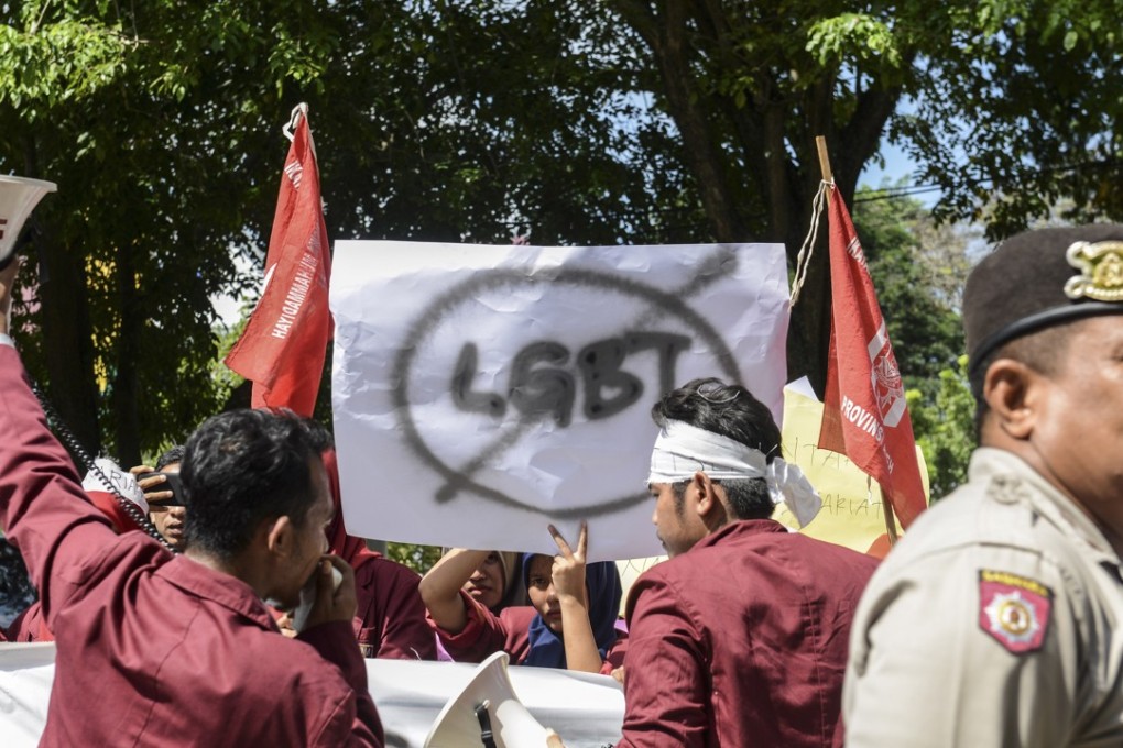 A group of Muslim protesters march with banners against the lesbian, gay, bisexual and transgender community in Banda Aceh in 2017. Photo: AFP