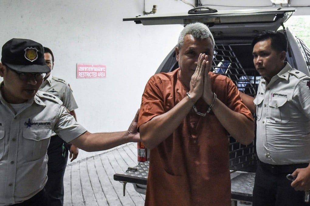 Thai actor, country singer and political activist Thanat Thanawatcharanon, better-known by his stage name ‘Tom Dundee’ leaves court after being acquitted. Photo: AFP