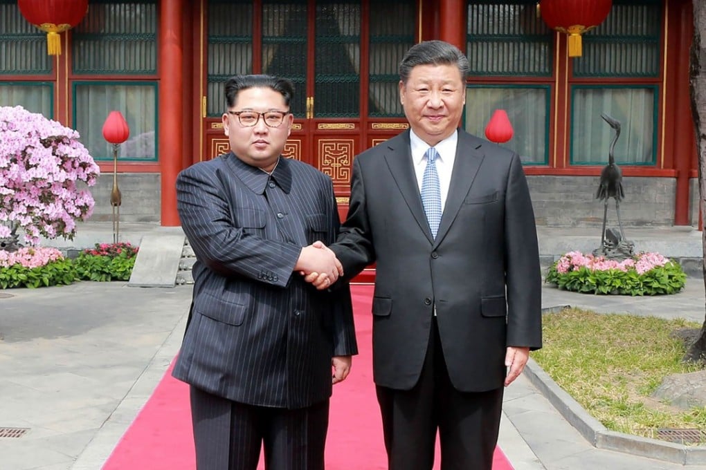 North Korean leader Kim Jong-un and China President Xi Jinping shaking hands during Kim’s visit to Beijing.  Photo: AFP/KCNA via KNS