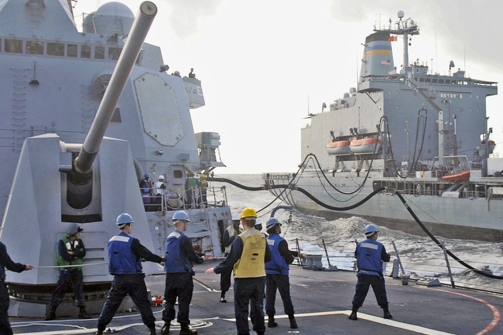Sailors aboard the guided missile destroyer USS Mustin. Photo: US Navy