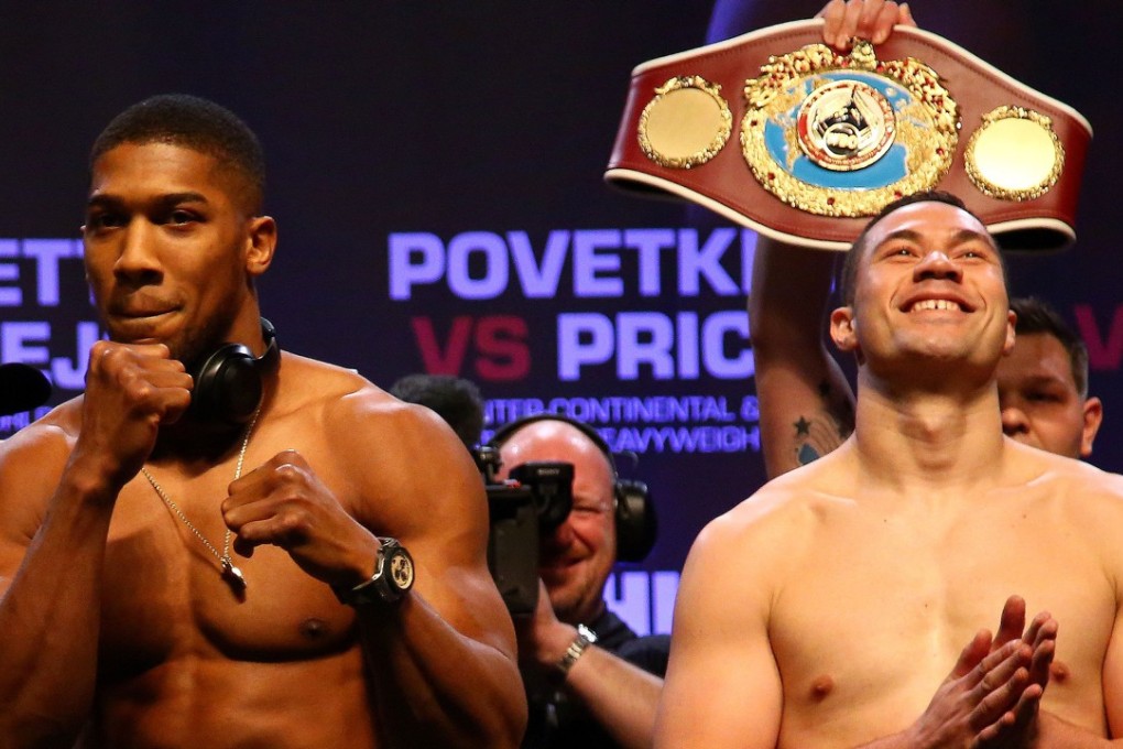 Britain's Anthony Joshua (left) and New Zealand's Joseph Parker at the weigh-in. Photo: AFP