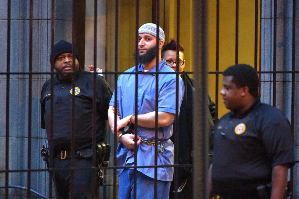 Officials escort “Serial” podcast subject Adnan Syed from the courthouse on February 3, 2016, following the completion of the first day of hearings for a retrial in Baltimore. Maryland's second-highest court has upheld a judge's ruling overturning the murder conviction of Syed. (Karl Merton Ferron/Baltimore Sun/TNS)