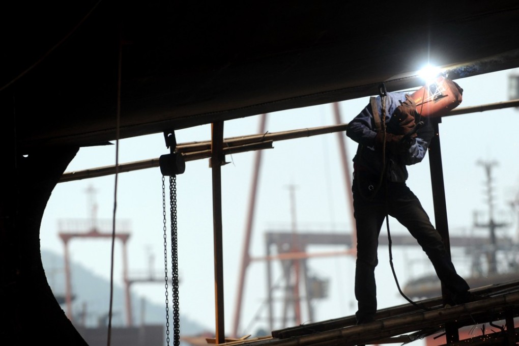 A welder at work at a shipyard in Songmen of Taizhou city in Zhejiang province on April 10, 2012. Photo: Xinhua