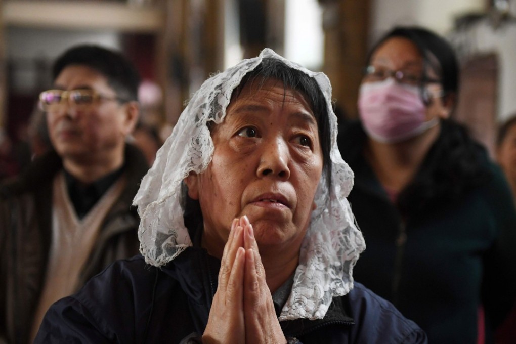 Catholic worshippers attend a mass on Holy Thursday, ahead of this year’s Easter celebrations at Beijing's government-sanctioned South Cathedral. Photo: Agence France-Presse