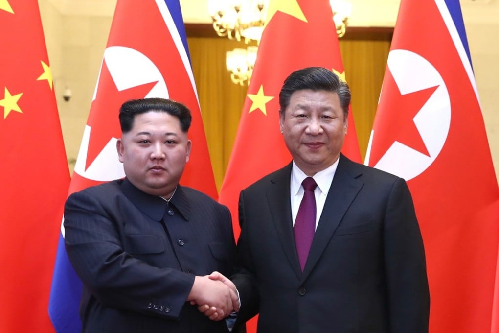 Kim Jong-un (left) pictured with President Xi Jinping during their meeting in Beijing. Photo: Xinhua