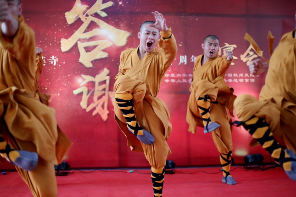 Chinese monks perform martial arts during a Chinese festival at Hsuan Tsang Monastery in Kolkata, India, on March 14. The two-day festival was organised by the Chinese consulate to mark the 50th anniversary of the monastery. Photo: EPA-EFE