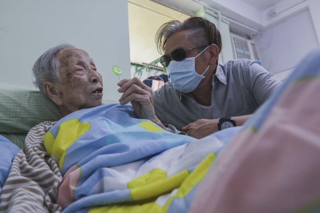 Chu Fung (left) is 101 years old and living in a full-day nursing home. Her grandson Chan Mong-wah wishes carers would spend more time with his grandmother to understand her needs. Photo: Edward Wong