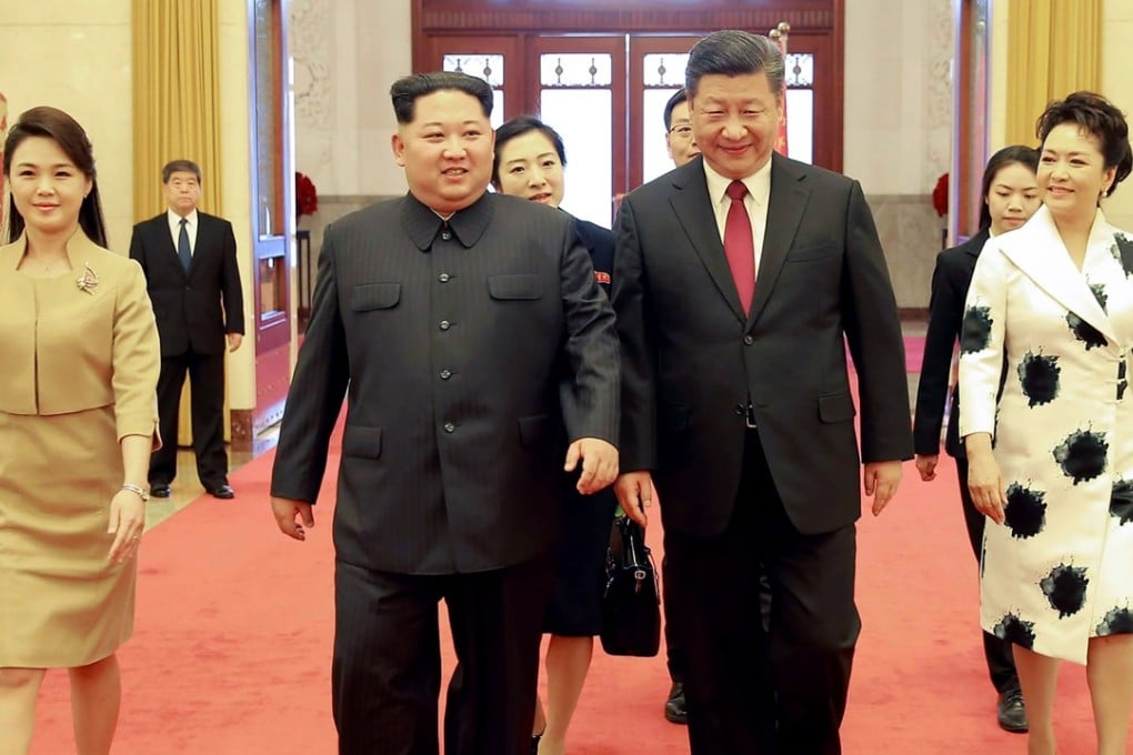 North Korean leader Kim Jong-un with Chinese President Xi Jinping and their wives in Beijing. Photo: AFP