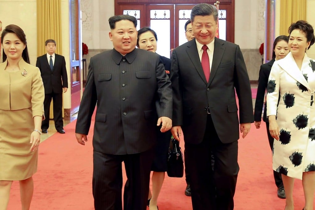 Xi Jinping (second from right) and his wife Peng Liyuan (right) with Kim Jong-un and his wife Ri Sol-ju at the Great Hall of the People in Beijing on Monday. Photo: AFP/KCNA via KNS
