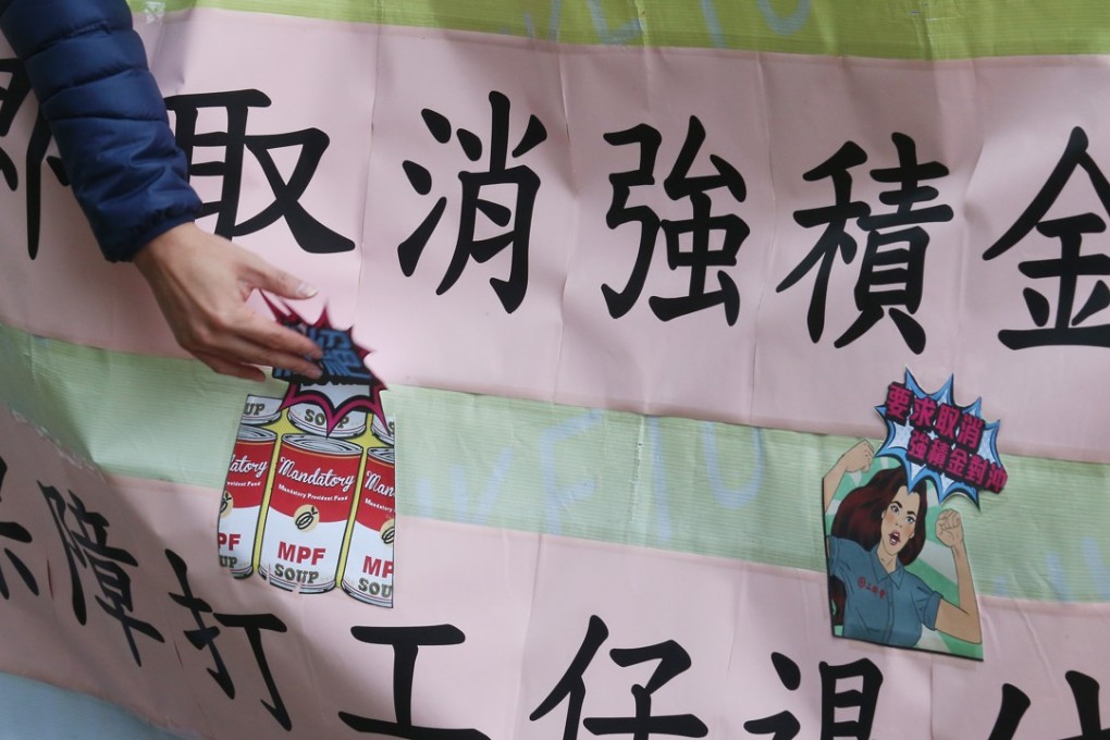 Members of the Federation of Trade Unions demand measures from the Hong Kong government to scrap the MPF offsetting mechanism. Photo: David Wong