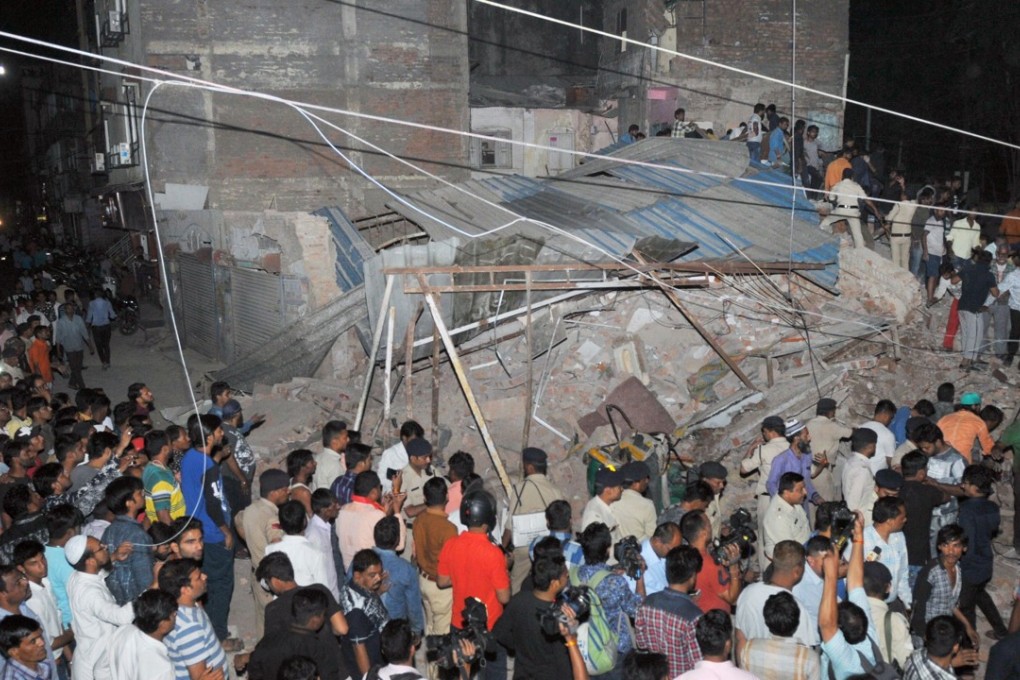 Ten people have died after a car crashed into a dilapidated building in central India and brought down the near century-old structure, burying them beneath rubble. Photo: AFP