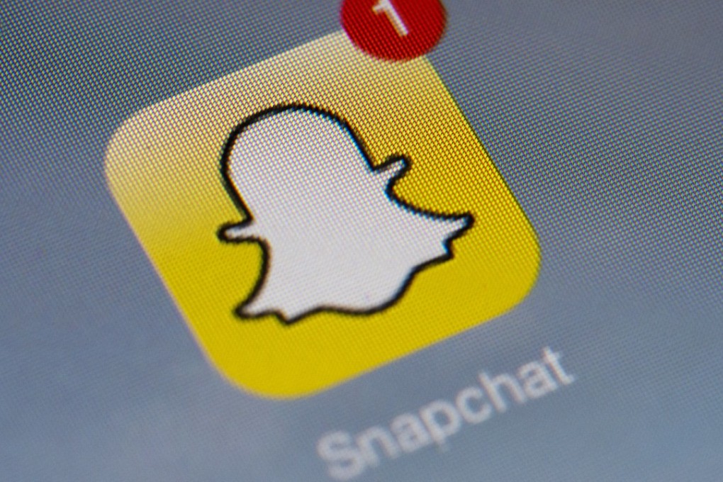 The logo of mobile app "Snapchat" is displayed on a tablet. Photo: AFP PHOTO/LIONEL BONAVENTURE