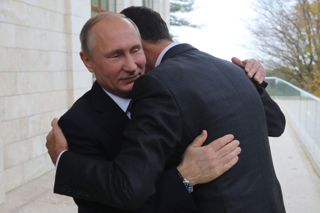 Russian President Vladimir Putin welcomes Syria’s Bashar al-Assad during a meeting in the Black Sea city of Sochi, last November 20. Photo: AFP