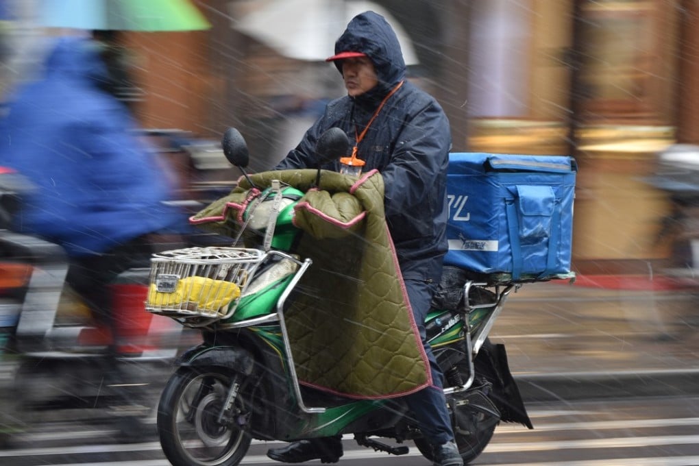 An Ele.me courier delivering meals in Shanghai. Alibaba’s buyout values Ele.me at US$9.5 billion. Photo: Imaginechina