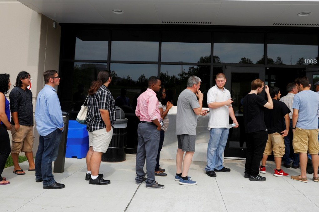 US job seekers in Fall River, Massachusetts, line up during Amazon Jobs Day, an event that aimed to fill more than 50,000 jobs on August 2, 2017. Last week, claims for state unemployment benefits fell to their lowest level since 1973. Photo: Reuters
