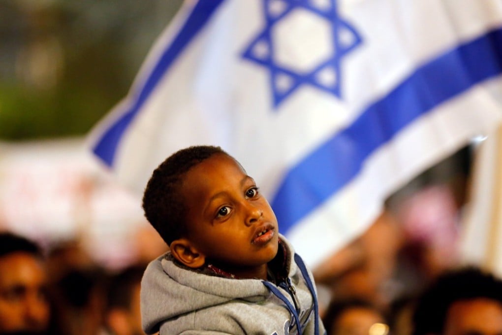 A boy takes part in a protest against the Israeli government’s former plan to deport African migrants in Tel Aviv on March 24, in this file photo. Photo: Reuters