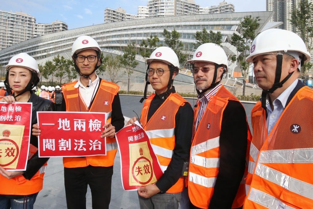 Hong Kong’s opposition lawmakers, including (from left) Tanya Chan and Eddie Chu Hoi-dick, protest against the proposed joint immigration checkpoint, in front of the West Kowloon terminus of the high-speed rail link, on February 27. Photo: David Wong