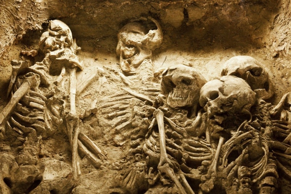 The skeletons of a family in an ancient sacrifice pit in China.