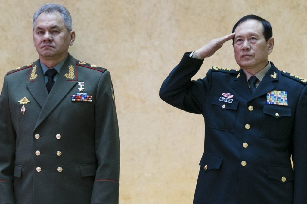 China’s Defence Minister Wei Fenghe, pictured with his Russian counterpart Sergei Shoigu, salutes during a review of an honour guard before their talks in Moscow on Tuesday. Photo: EPA-EFE