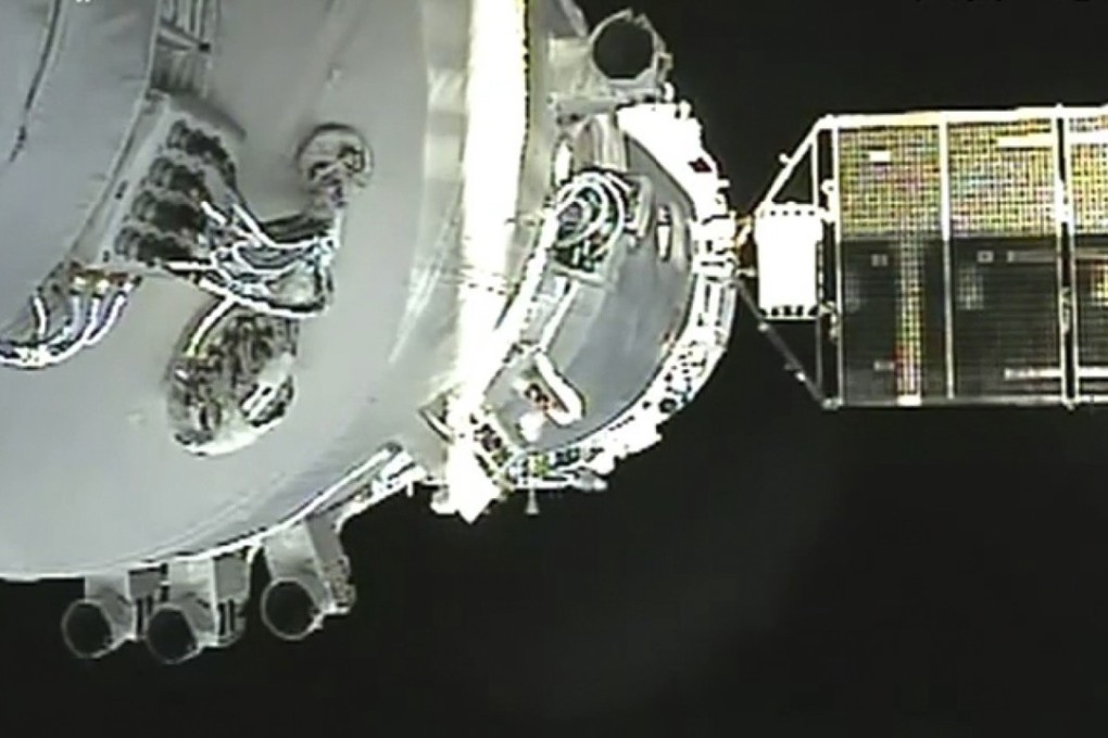 FILE - In this Nov. 3, 2011, file image from November 2011  shows China's Shenzhou-8 spacecraft docked with the orbiting Tiangong-1 space station. Photo: CCTV via AP Video, File