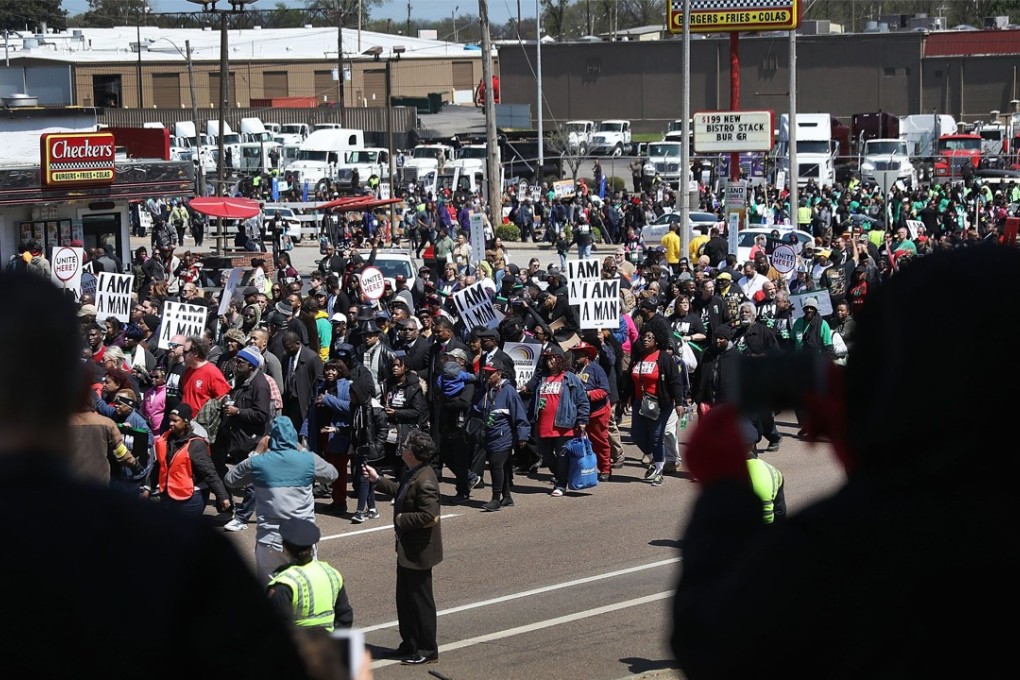 People watch as marchers pass-by during an event to mark the 50th anniversary of Dr Martin Luther King Jnr's assassination in Memphis, Tennessee, on April 4. Photo: Getty Images via AFP