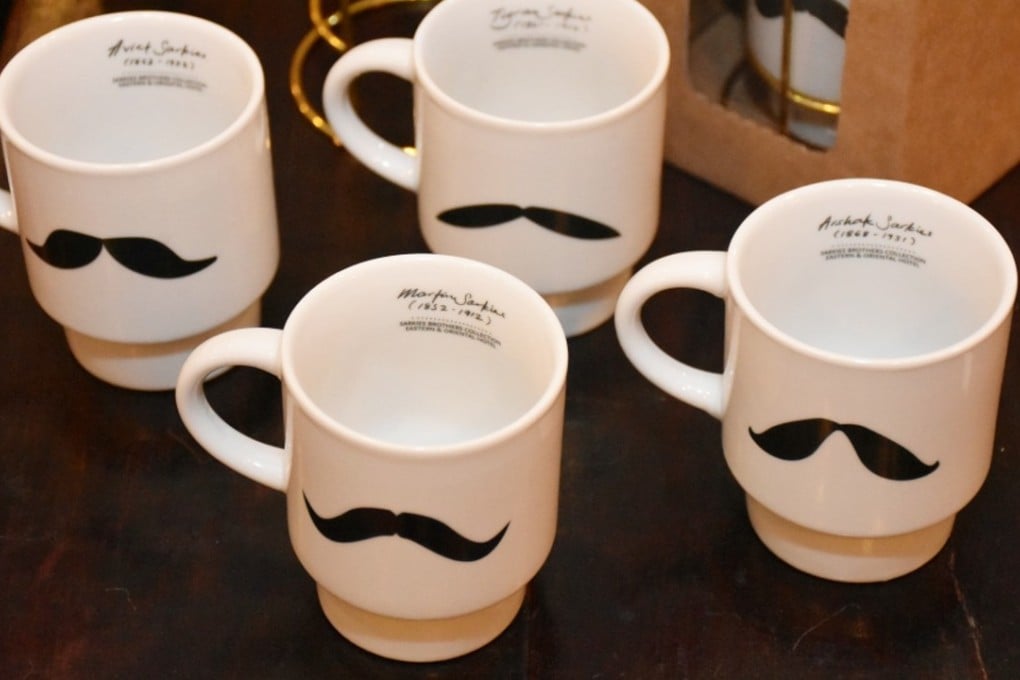 Mugs with the signature moustache of the Sarkies brothers from the E&O Hotel. Photo: Handout