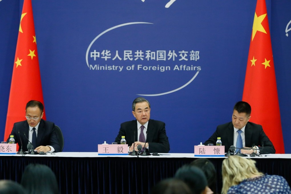 China’s Foreign Minister Wang Yi (centre) attends a press briefing to discuss this year’s Boao Forum for Asia in Beijing on Tuesday. Photo: EPA-EFE