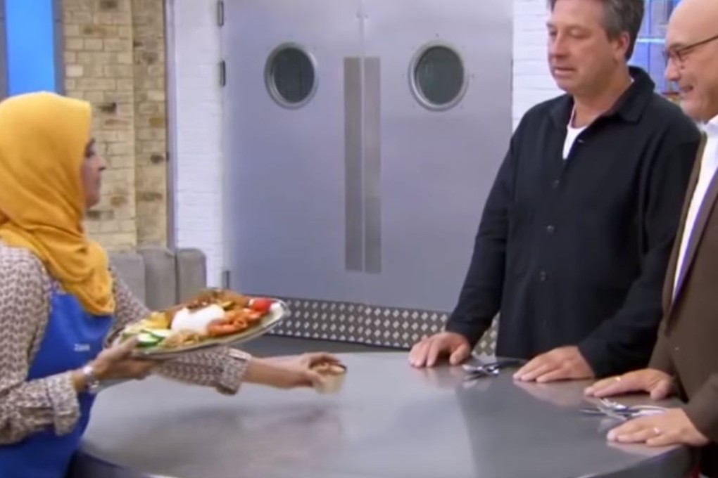 Zaleha Kadir Olpin presents her rendang to MasterChef UK judge Gregg Wallace, right. Photo: BBC