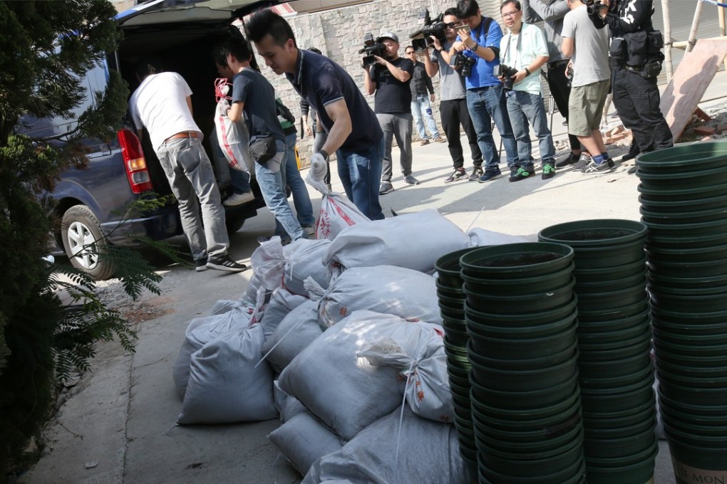 Officers swooped on the three-storey village house in Kam Tsin Village on Friday. Photo: David Wong