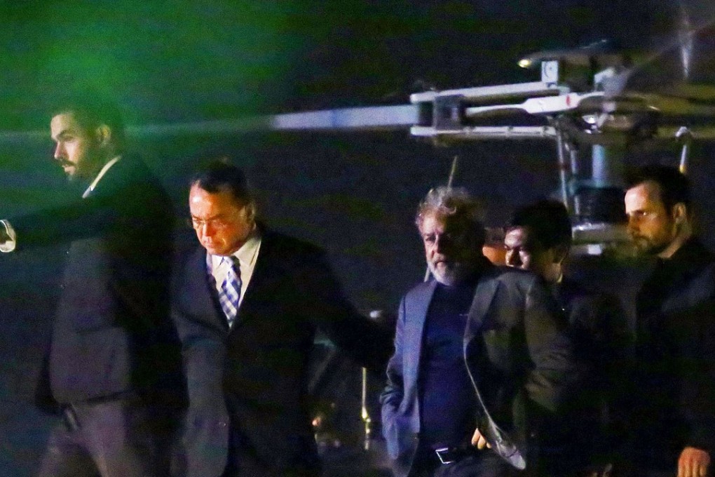 Brazilian ex-president Luiz Inacio Lula da Silva arrives at the Federal Police headquarters where he is due to serve his 12-year prison sentence, in Curitiba. Photo: AFP