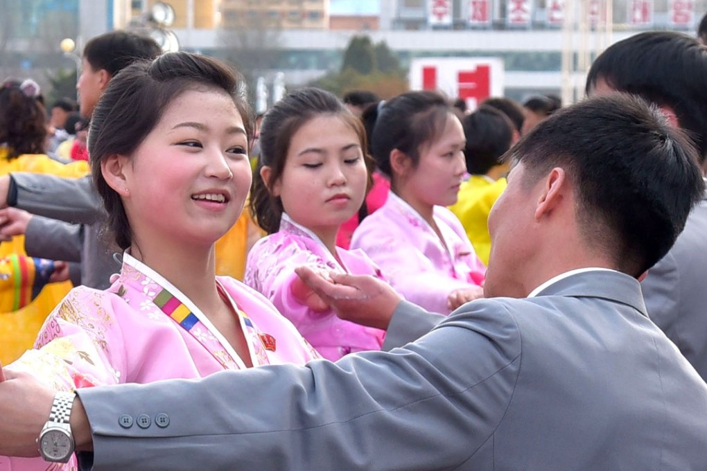 Students dance to mark the 25th anniversary of Kim Jong-il’s election as chairman of the National Defence Commission. Photo: Reuters