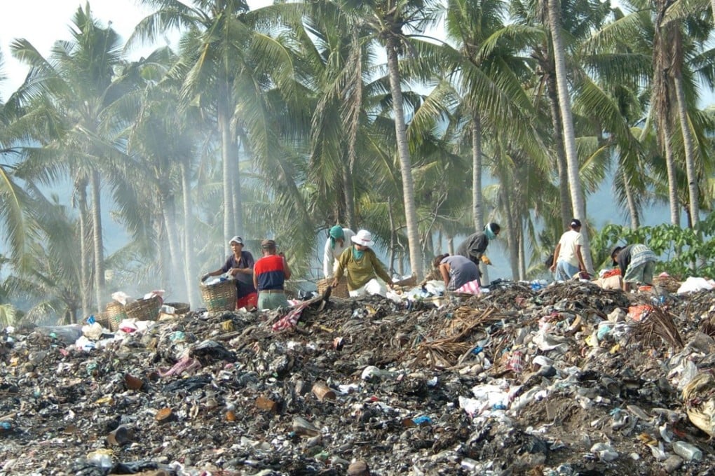 Scavengers sift through piles of garbage dumped on a hillside in the central Philippine resort island of Boracay. The worsening garbage problem on the island could threaten Boracay's image as a pristine paradise for foreign and local tourists. Photo: AFP