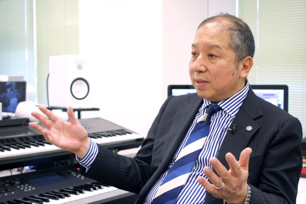 Japanese musician Minoru Mukaiya speaking at his workplace in Tokyo last month. Mukaiya is a composer of ‘hassha merodii’ or train departure melodies, short jingles that whisk commuters on their way at some of the world's busiest stations. Photo: AFP