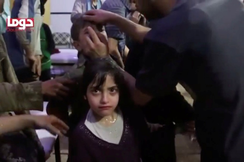 A girl gets treated after an alleged chemical weapons attack in Douma, Syria. Photo: Reuters