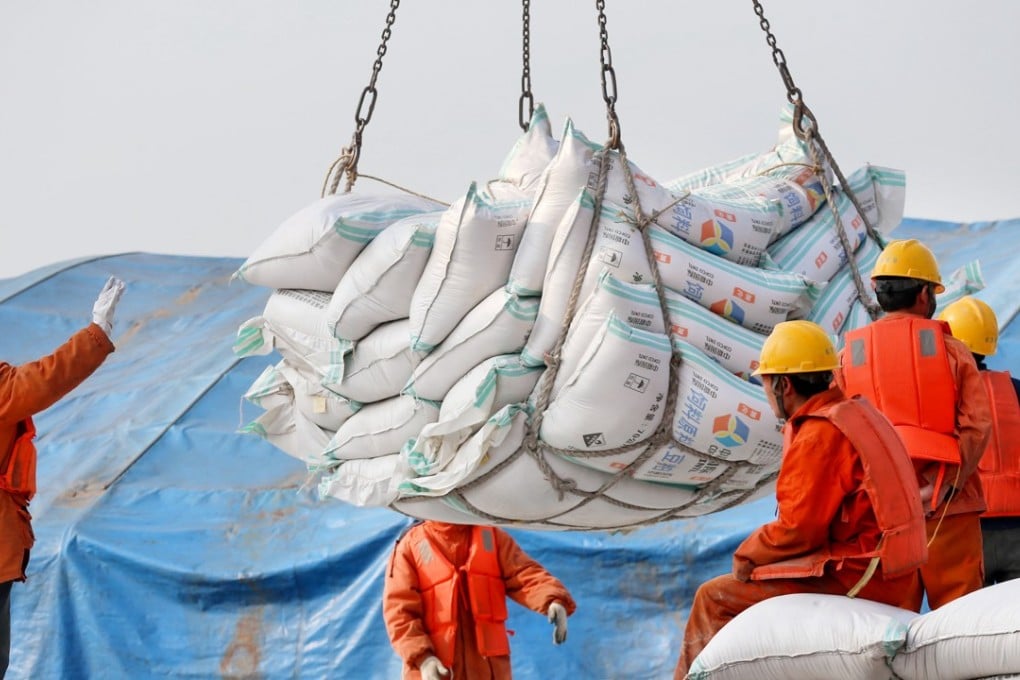 Workers transport imported soybean products at a port in Nantong, in China’s Jiangsu province. In a keynote speech in Boao on Tuesday, President Xi Jinping alluded that Beijing was working hard to increase imports. Photo: Reuters