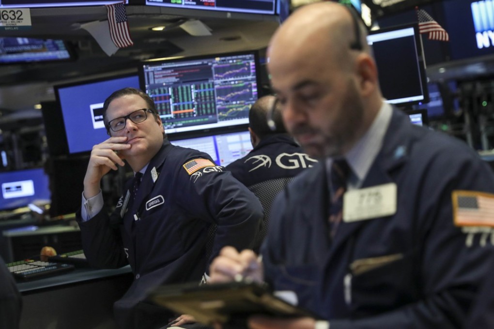 Traders and financial professionals on the floor of the New York Stock Exchange. There are many ways in which China could inflict pain on the US, says Putnam. These include via capital flows. Photo: AFP