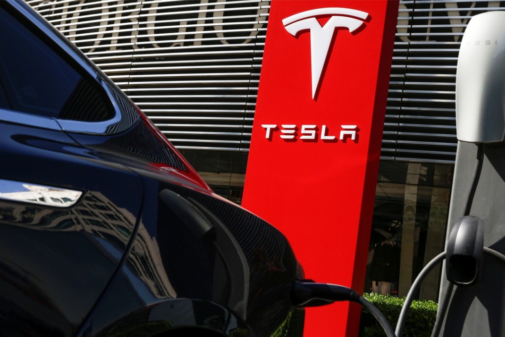 A Tesla recharges at a charging station in Beijing, China. As part of a global recall, Tesla will recall 8,898 Model S vehicles in China to replace bolts in the power steering component. Photo: Reuters
