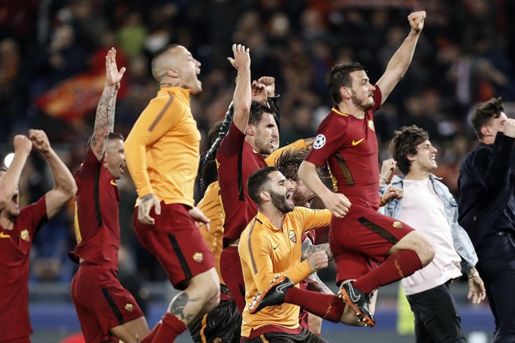 Roma celebrate their shock victory against Barcelona. Photo: EPA