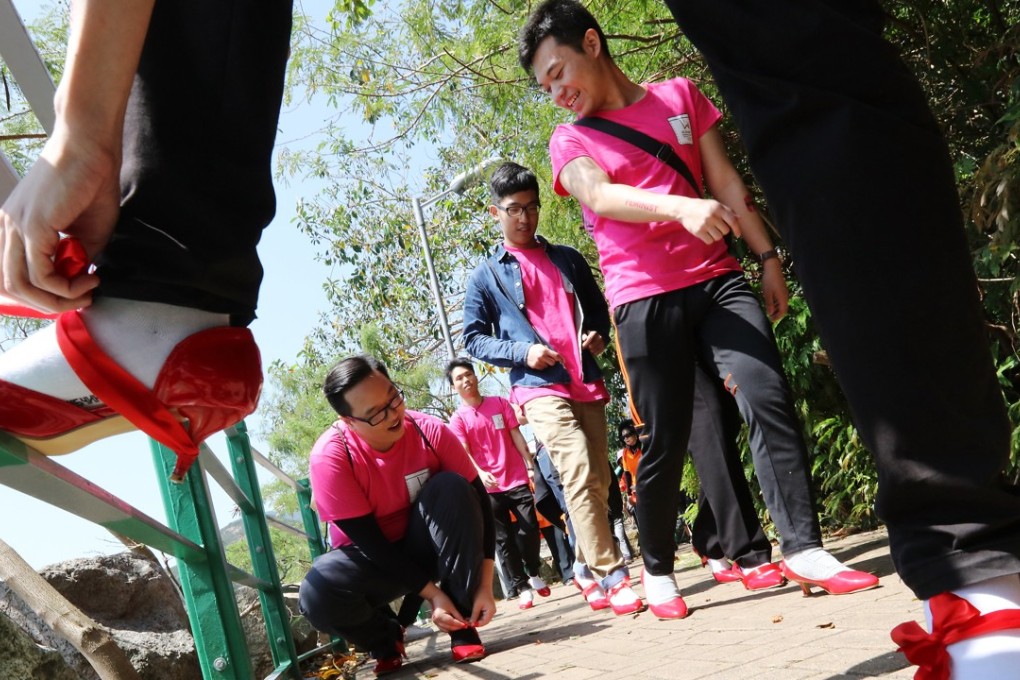 Men wear high heels to experience life as women in the Walk in Her Shoes charity event from Deep Water Bay to Seaview Promenade, in Hong Kong, in April 2017. Photo: Felix Wong