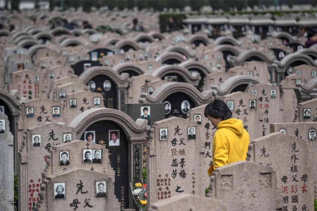 A woman pays her respects to the deceased during the Ching Ming (or Qing Ming) festival last Friday, at a cemetery in Shanghai. It is customary for Chinese people to tend to the graves of their departed loved ones during Ching Ming. Photo: AFP