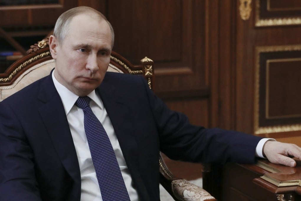 Russian President Vladimir Putin listens during a meeting with Agriculture Minister Alexander Tkachev in Moscow, Russia, on Monday. The postponement of bond sales in Moscow is the best indication sanctions against Russia are starting to bite. Photo: Sputnik, Kremlin pool via AP