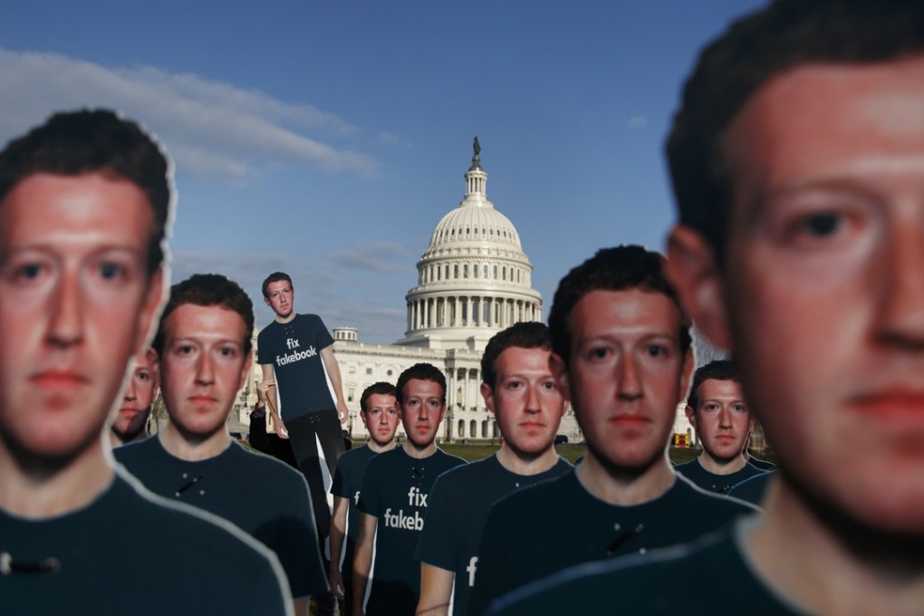 Life-size cut-outs depicting Facebook CEO Mark Zuckerberg wearing ‘Fix Fakebook’ T-shirts are displayed by advocacy group, Avaaz, on the southeast Lawn on Capitol Hill in Washington. Photo: AP