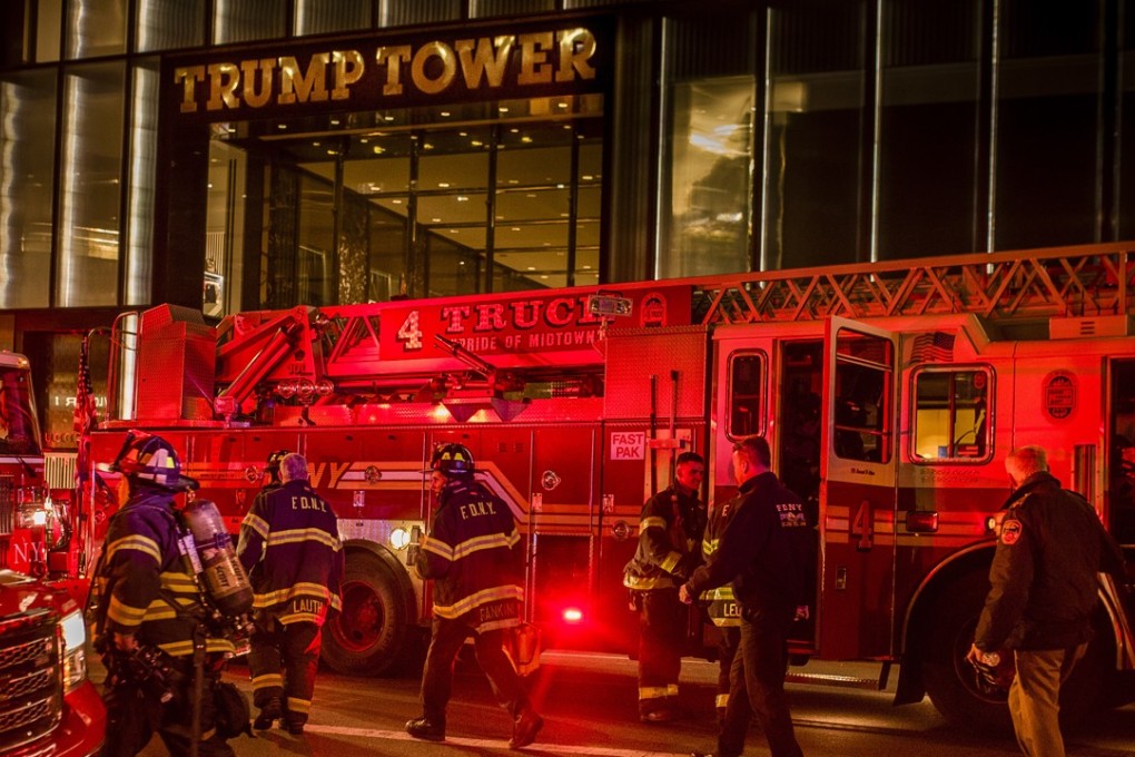 Firefighters at Trump Tower in New York, where a blaze broke out on the 50th floor on April 7. One man died and six firefighters were injured. Photo: AP