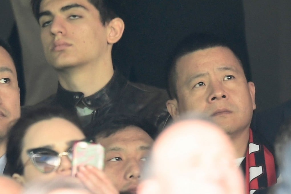 Chinese businessman and new owner of AC Milan Li Yonghong (right) before the Milan derby in April 2017, his first game as owner. Photo: AFP