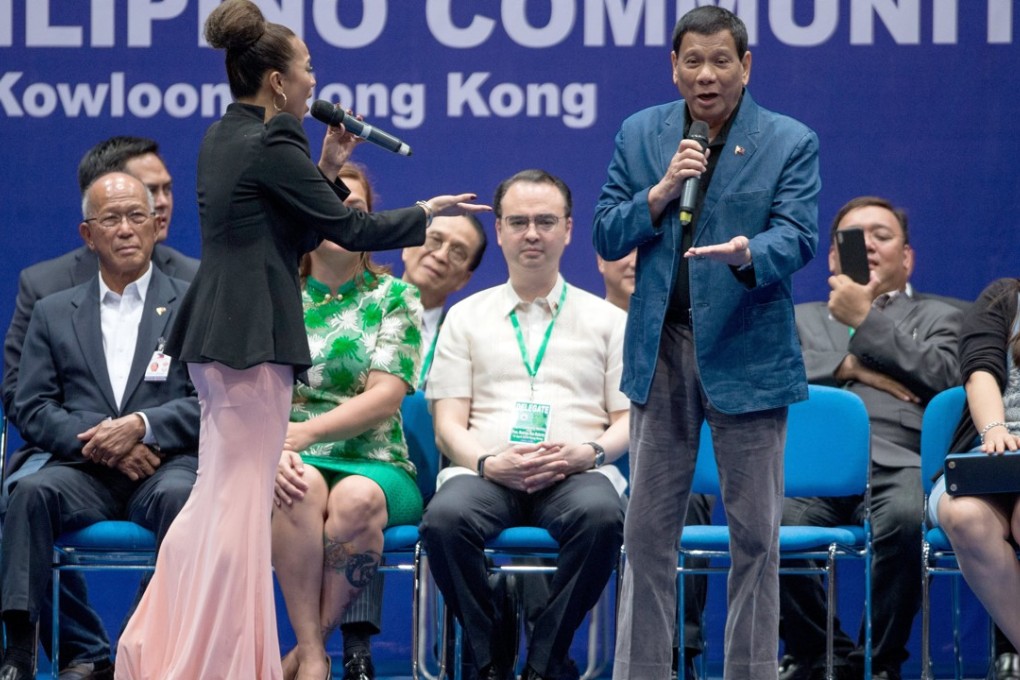 Philippine President Rodrigo Duterte sings at an event with members of the Filipino community in Hong Kong. Photo: EPA