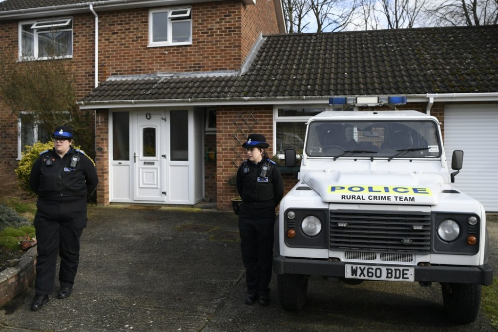 Police stand outside what is believed to be the home of former Russian spy Sergei Skripal in Salisbury. Photo: EPA