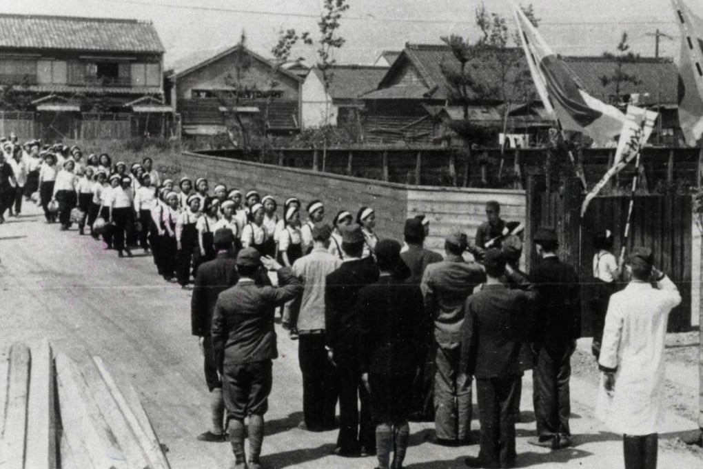 South Korean women march to work under surveillance by Japanese soldiers while the country was under colonial rule. Photo: AFP