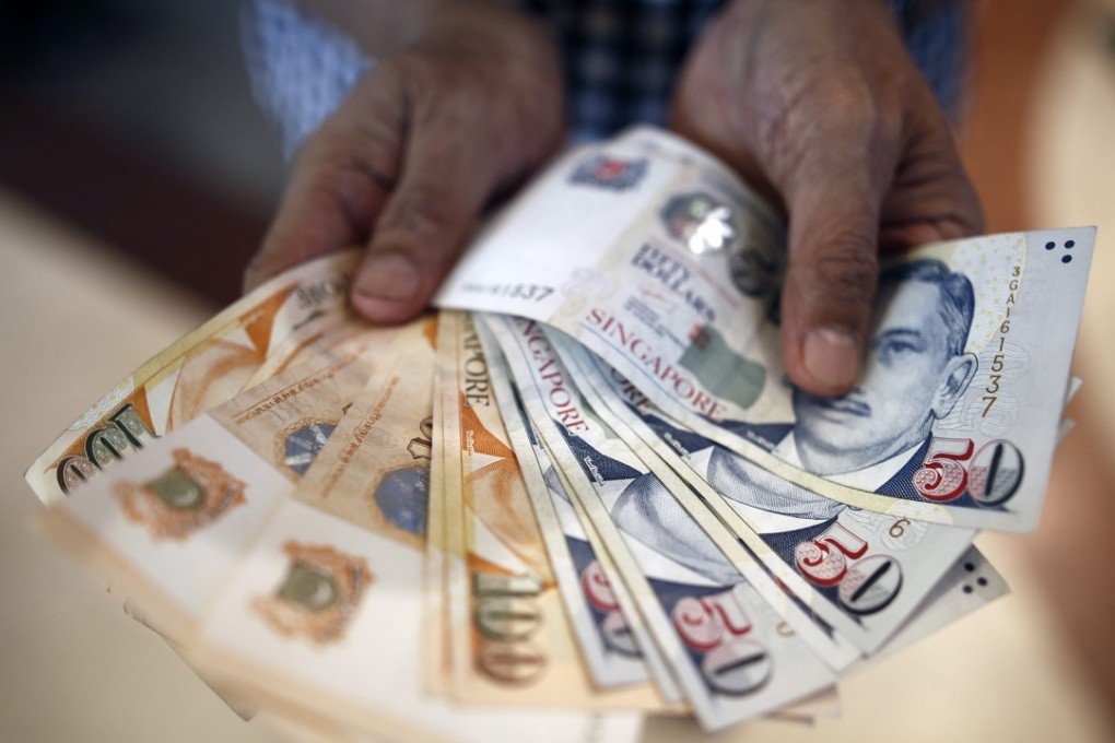 The Monetary Authority of Singapore, which uses the exchange rate as its main policy tool, increased the slope of the currency band slightly from zero per cent. Photo: EPA