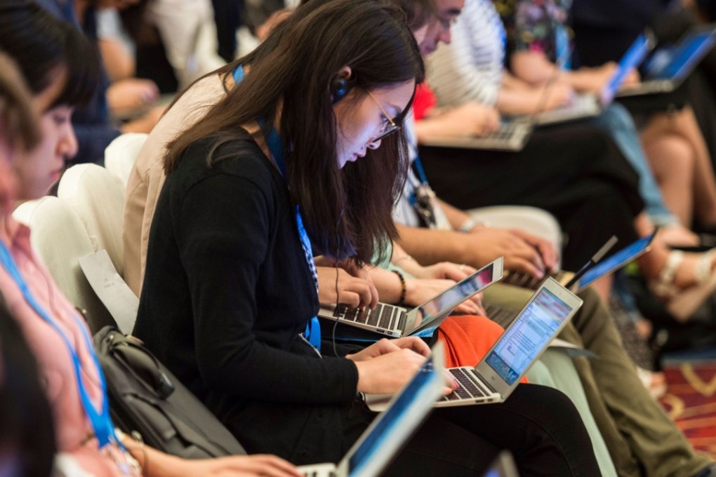 Chinese journalists cover a high-level tax symposium, on the sidelines of the G20 finance ministers’ meeting, in Chengdu in July 2016. Photo: AFP